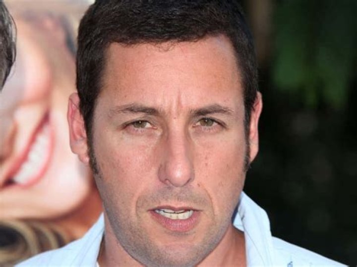 Adam Sandler smiles in the East Village