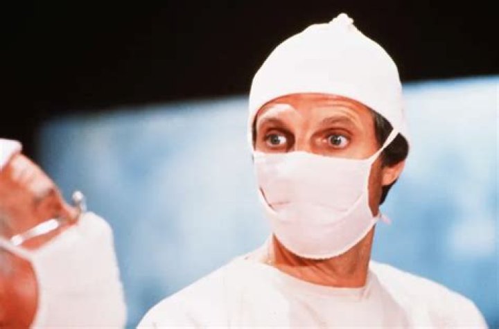 Alan Alda Dons A Mask