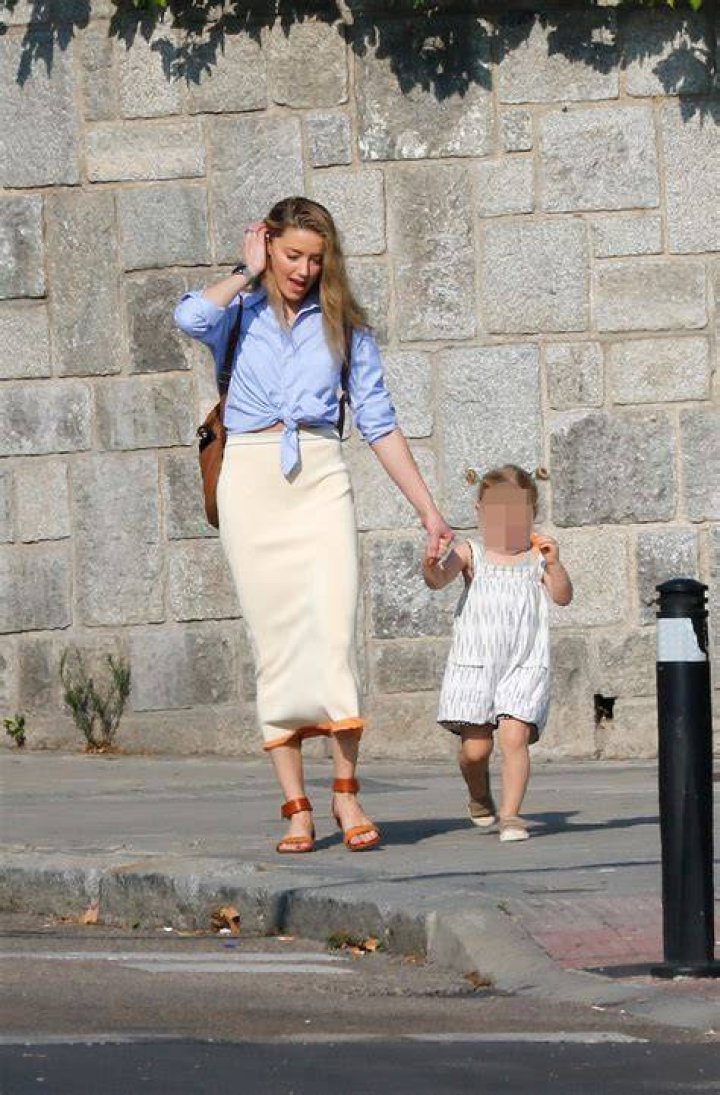 Amber Heard Ditches Cane & Holds Hands With Daughter Oonagh Paige, 2, During Rare Outing in Madrid: Photos