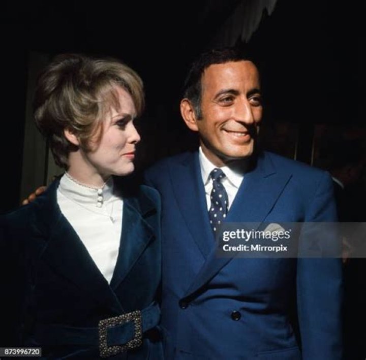 American Singer Tony Bennett With His Wife Actress Sandra Grant And Their Two Children Antonia (3) And Joanna (7) At Art Exhibition At The Milne-henderson Gallery In Mount Street London Anthony Dominick Benedetto Better Known As Tony Bennett (born August 3 1926) Is An American Singer Of Popular Music Standards Show Tunes And Jazz. Bennett Is Also A Serious And Accomplished Painter Having Created Works A Under The Name Anthony Benedetto A That Are On Permanent Public Display In Several Institutions. He Is The Founder Of Frank Sinatra School Of The Arts In New York City. Raised In New York City Bennett Began Singing At An Early Age. He Fought In The Final Stages Of World War Ii As An Infantryman With The U.s. Army In The European Theatre. Afterwards He Developed His Singing Technique Signed With Columbia Records And Had His First Number One Popular Song With 'because Of You' In 1951. Several Top Hits Such As 'rags To Riches' Followed In The Early 1950s. Bennett Then Further Refined His Approach To Encompass Jazz Singing. He Reached An Artistic Peak In The Late 1950s With Albums Such As The Beat Of My Heart And Basie Swings Bennett Sings. In 1962 Bennett Recorded His Signature Song 'i Left My Heart In San Francisco'. His Career And His Personal Life Then Suffered An Extended Downturn During The Height Of The Rock Music Era. Bennett Staged A Remarkable Comeback In The Late 1980s And 1990s Putting Out Gold Record Albums Again And Expanding His Audience To The Mtv Generation While Keeping His Musical Style Intact. He Remains A Popular And Critically Praised Recording Artist And Concert Performer In The 2010s. Bennett Has Won 17 Grammy Awards (including A Lifetime Achievement Award Presented In 2001) And Two Emmy Awards And Has Been Named An Nea Jazz Master And A Kennedy Center Honoree. He Has Sold Over 50 Million Records Worldwide. American Singer Tony Bennett With His Wife Actress Sandra Grant A...