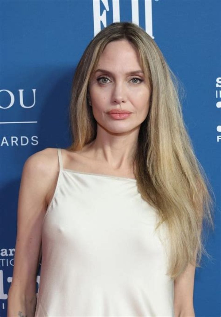Angelina Jolie in a cream jumpsuit