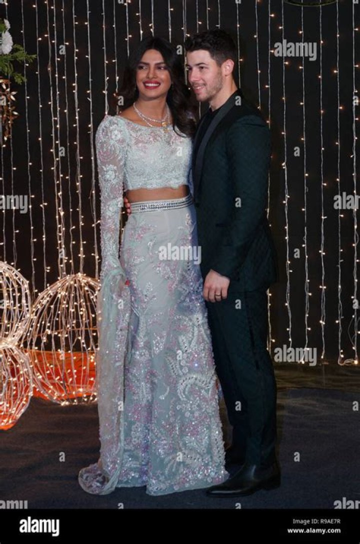 Bollywood actress Priyanka Chopra and musician Nick Jonas stand for photographs at their wedding reception in Mumbai, India Chopra Jonas Wedding, Mumbai, India - 19 Dec 2018