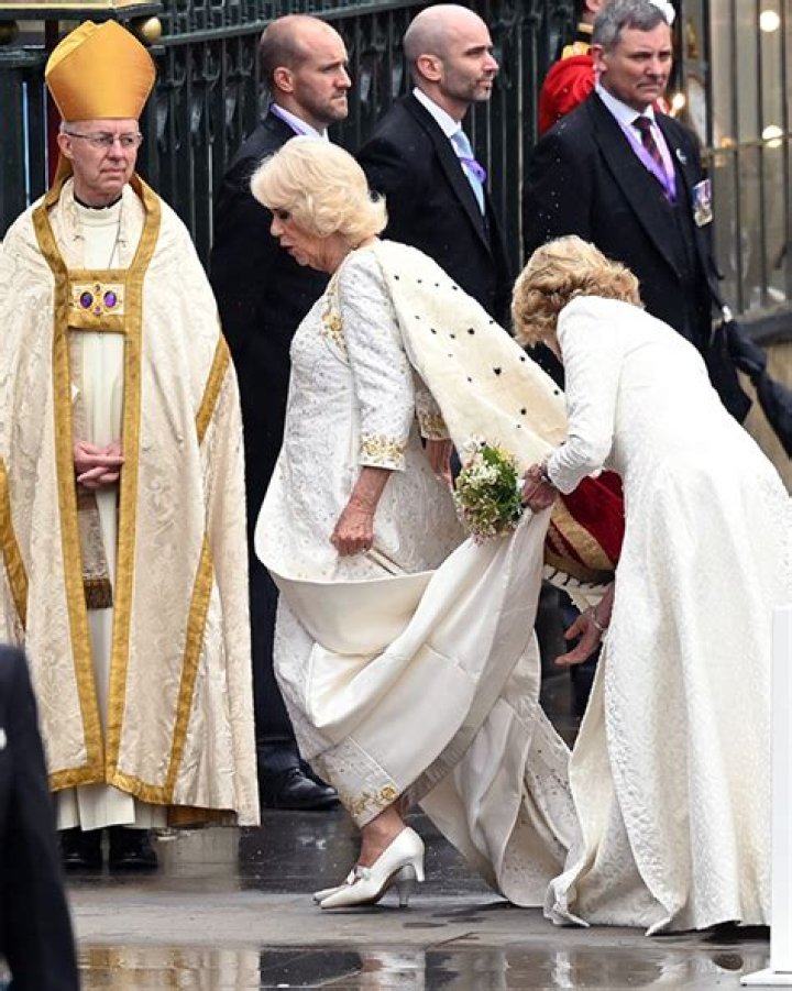 Camilla Parker Bowles smiles next to Prince Charles as they head to Westminster Abbey in their royal carriage on May 6, 2023
