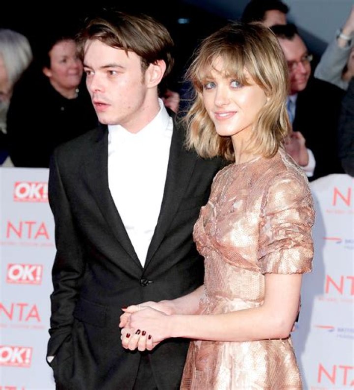 Charlie Heaton and Natalia Dyer pose for photographers upon arrival at the Dior Men's fashion collection presented in London Dior Men Fashion Photo Call, London, United Kingdom - 09 Dec 2021