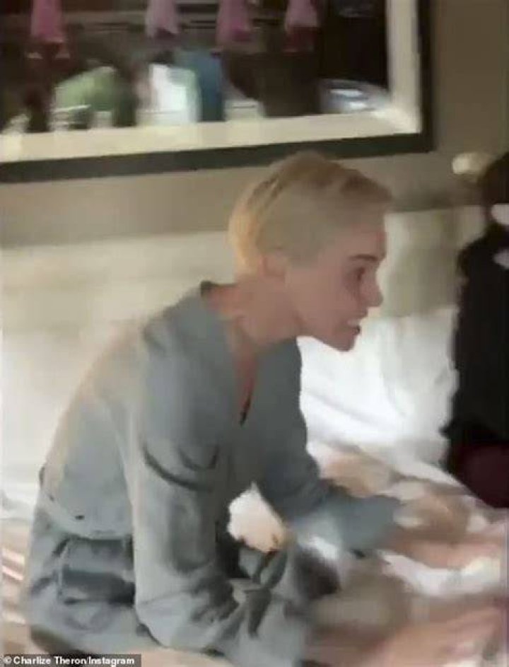Charlize Theron Accidentally Flashes Her Friends & Screams When Her Robe Slips Open — Watch