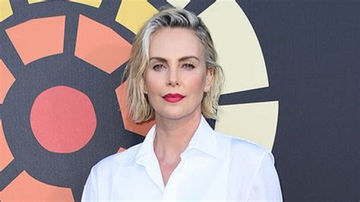 Charlize Theron Arrives In Los Cabos For Family Getaway With Daughters Jackson, 9, & August, 6 – Photos