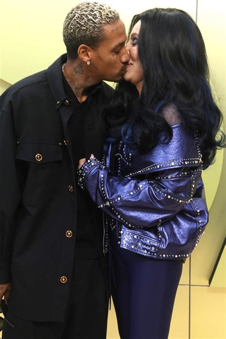 Cher, 76, & Alexander Edwards, 37, Kiss At Versace Show: Photos