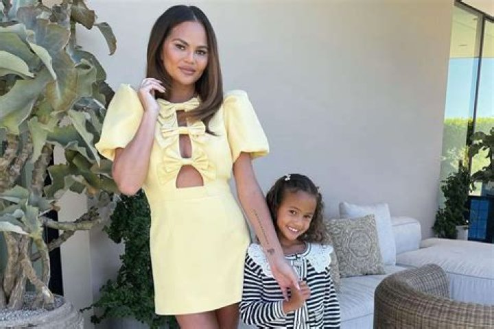 Chrissy Teigen Models With Luna