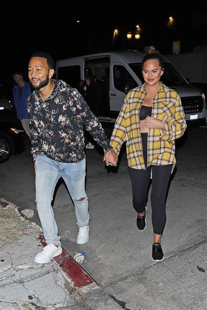 Chrissy Teigen Puts Baby Bump On Display In Crop Top As She Holds Hands With John Legend