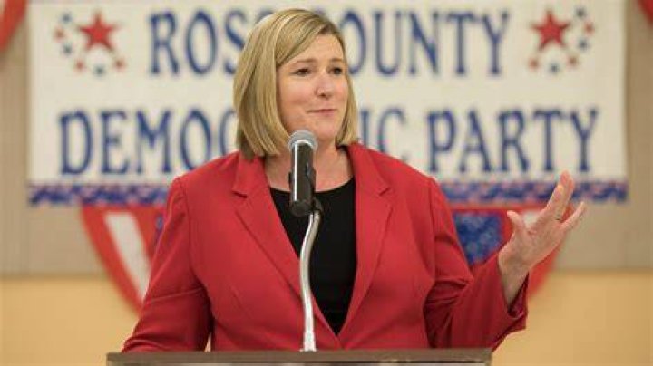 Dayton Mayor Nan Whaley is consoled by a member of a religious community