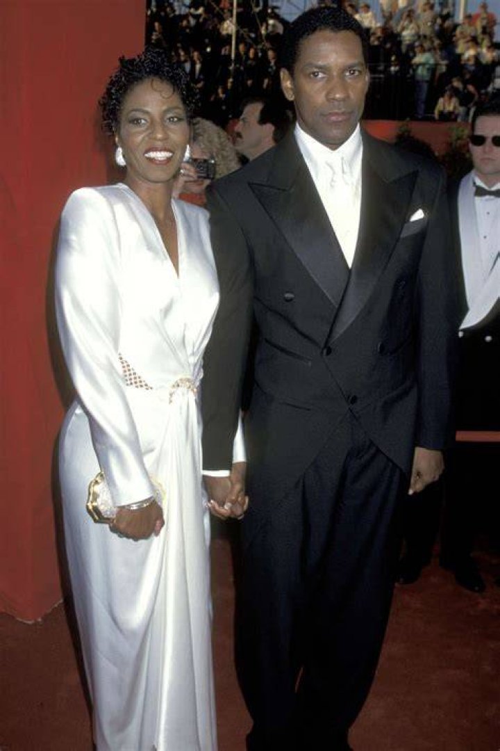 Denzel Washington and Pauletta Washington smile