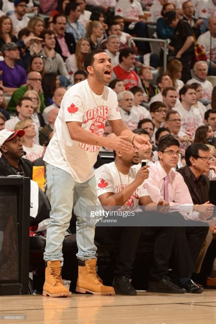 Drake cheers on the Toronto Raptors as they play the Brooklyn Nets