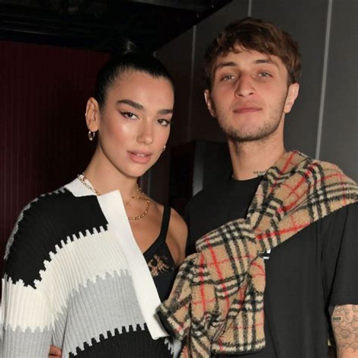Dua Lipa & Anwar Hadid kiss while surfing in Malibu