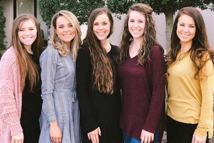 Duggar family posing at Jill Duggar and Derick Dillard's wedding