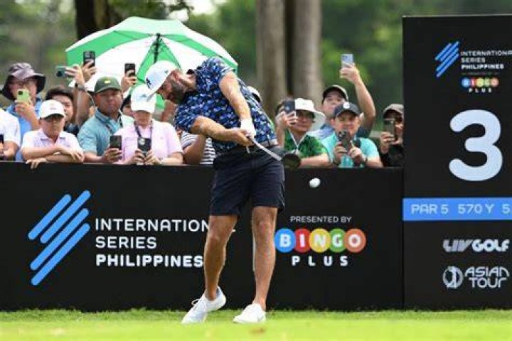 Dustin Johnson of the US, left, walks with his partner Paulina Gretzky on 16th green at the end of a fourball match on the opening day of the 42nd Ryder Cup at Le Golf National in Saint-Quentin-en-Yvelines, outside Paris, France, . Johnson and Fowler won 4 and 2 over Europe's Rory McIlroy and Thorbjorn Olesen Ryder Cup Golf, Saint-Quentin-en-Yvelines, France - 28 Sep 2018