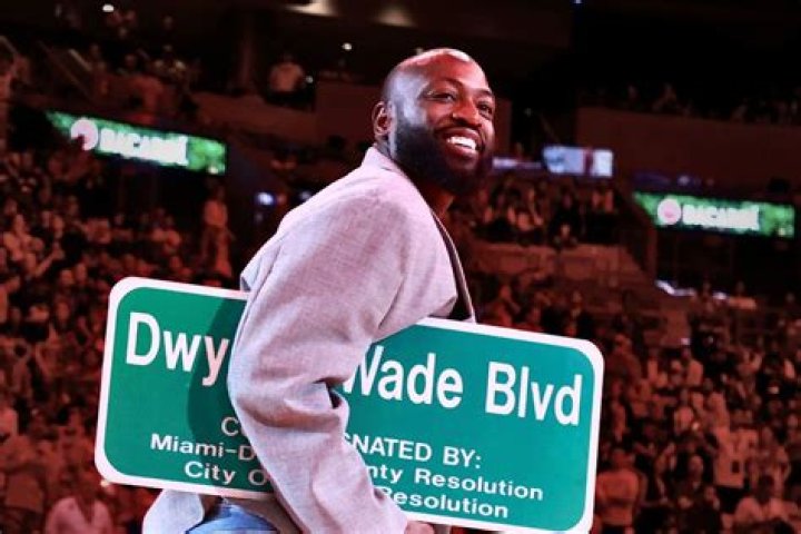 Dwayne Wade holds up the legend award as he is covered in gold slime at the Kids' Choice Sports Awards, at the Barker Hangar in Santa Monica, Calif 2019 Kids' Choice Sports Awards - Show, Santa Monica, USA - 11 Jul 2019