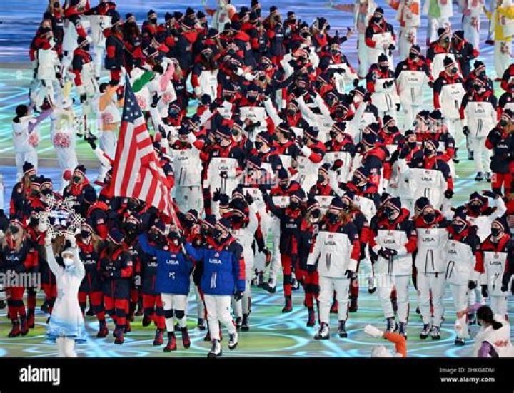 Elana Meyers Taylor and John Shuster, of the United States, carry their national flag into the stadium during the opening ceremony of the 2022 Winter Olympics, in Beijing Olympics Opening Ceremony, Beijing, China - 04 Feb 2022