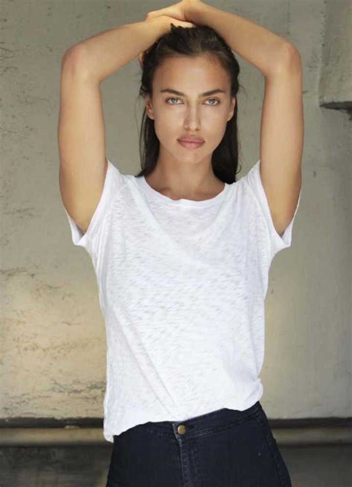 EXCLUSIVE: Irina Shayk photographed in green bikini in ibiza whilst taking a swim with a large group of friends who were celebrating friend Riccardo Tisci's birthday at hotel resort Six Senses. 04 Aug 2022 Pictured: Irina Shayk. Photo credit: Elkin Cabarcas / MEGA TheMegaAgency.com +1 888 505 6342 (Mega Agency TagID: MEGA883852_001.jpg) [Photo via Mega Agency]