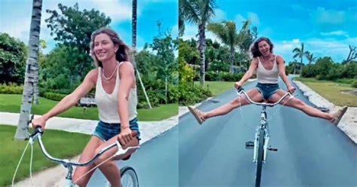 Gisele Rocks Daisy Dukes, Tom Brady’s Bucs Jersey, & Arm Sling As She Watches His Game From Home