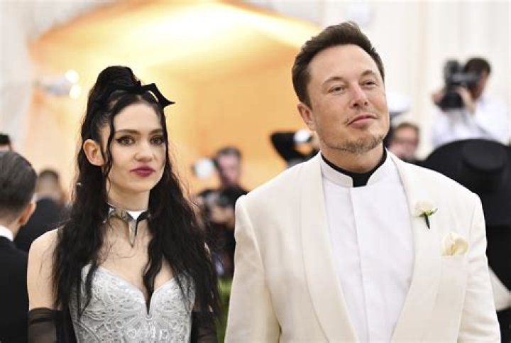 Grimes, left, and Elon Musk attend The Metropolitan Museum of Art's Costume Institute benefit gala in New York on . The Tesla and SpaceX founder tells the New York Post that he and the Canadian singer are "semi-separated." But he says they remain on good terms, she still lives at his house in California and they continue to raise their 1-year-old son together People-Elon Musk Grimes, New York, United States - 07 May 2018