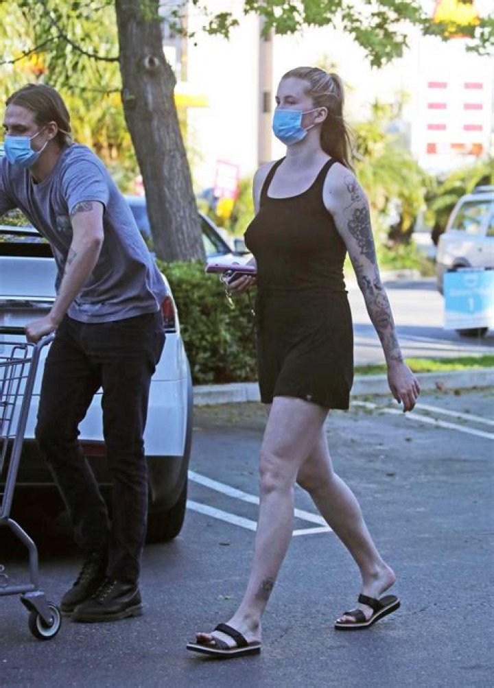 Ireland Baldwin in a Black & Lace Leather Dress