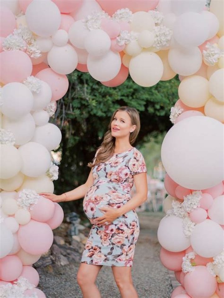 Joanna Krupa Stands Underneath The Party Balloon Arch