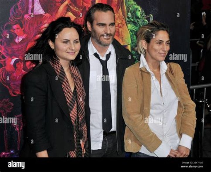 Joaquin Phoenix with sisters Rain and Summer at the Art of Elysium