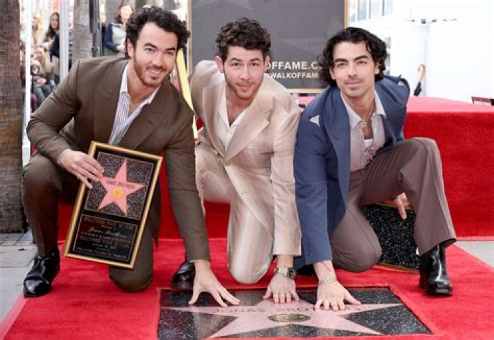 Jonas Brothers & Wives At The Walk of Fame Ceremony