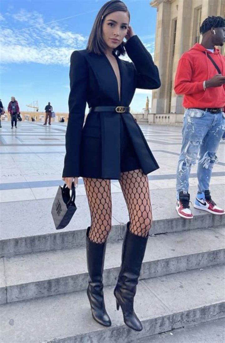 Jordyn Woods Stuns In Fishnet Stockings & Red Bottom Heels In Hot New ‘Boss’ Pic