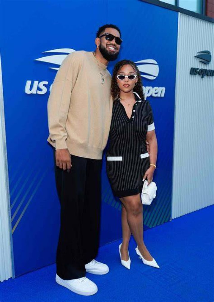Jordyn Woods Wears Sexy Cutout Dress & Snuggles Karl-Anthony Towns On 1 Year Anniversary Trip