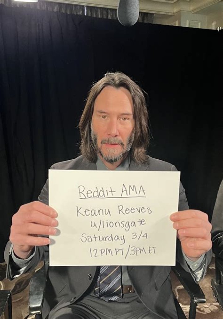 Keanu Reeves poses at a fashion show