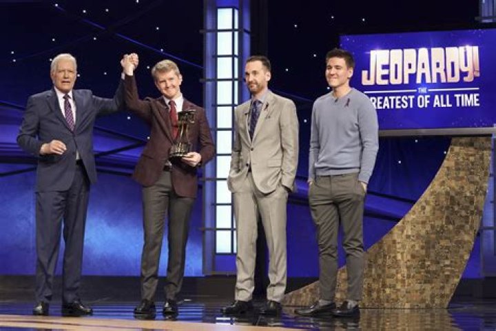 Ken Jennings, Brad Rutter Jeopardy!" champions Ken Jennings, left, and Brad Rutter, right, look on as an IBM computer called "Watson" beats them to the buzzer to answer a question during a practice round of the "Jeopardy!" quiz show in Yorktown Heights, N.Y., . It's the size of 10 refrigerators, and it swallows encyclopedias whole, but an IBM computer was lacking one thing it needed to battle the greatest champions from the "Jeopardy!" quiz TV show - it couldn't hit a buzzer. But that's been fixed, and on Thursday the hardware and software system named Watson played a competitive practice round against two champions. A "Jeopardy!" show featuring the computer will air in mid-February, 2011 Man vs Machine, Yorktown Heights, USA