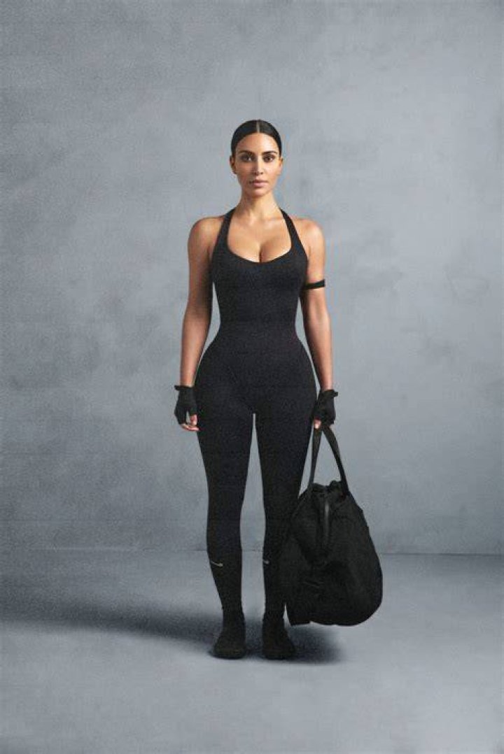 Khloe Kardashian Flaunts Cleavage & Curves In Lacy Bodysuit For Denim Line Launch — Pics