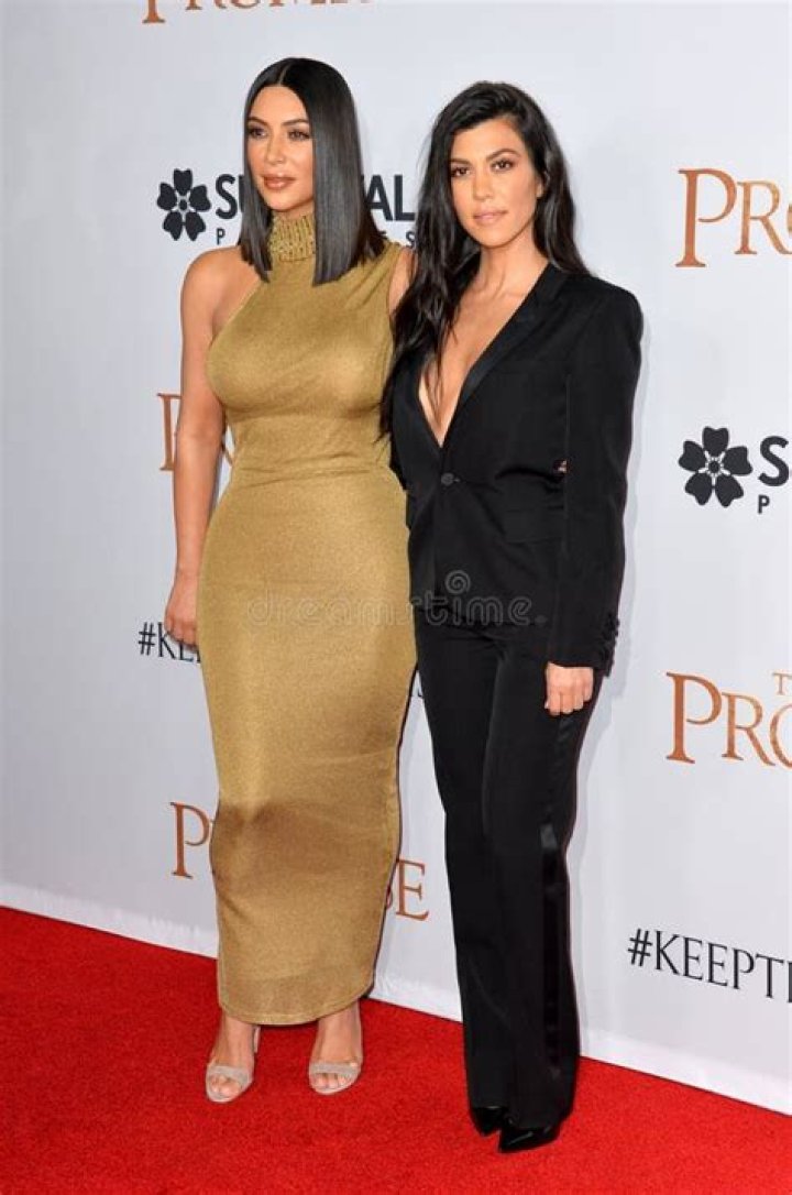 Kim Kardashian & Kourtney Kardashian outside