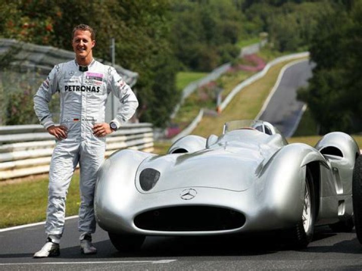 Michael Schumacher Poses With a Young Fan in 2003