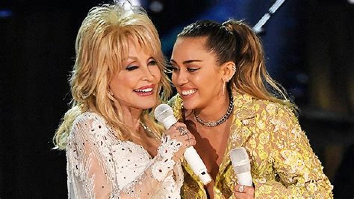 Miley Cyrus In Black Mini Dress With Dolly Parton In NYE Promo: Video – Hollywood Life