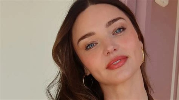 Miranda Kerr wows in white gown at the Vanity Fair Oscars after-party.