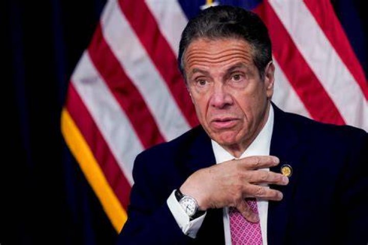 New York Gov. Andrew Cuomo, right, prepares to board a helicopter after announcing his resignation, in New York. Cuomo says he will resign over a barrage of sexual harassment allegations. The three-term Democratic governor's decision, which will take effect in two weeks, was announced Tuesday as momentum built in the Legislature to remove him by impeachment Cuomo Sexual Harassment, New York, United States - 10 Aug 2021