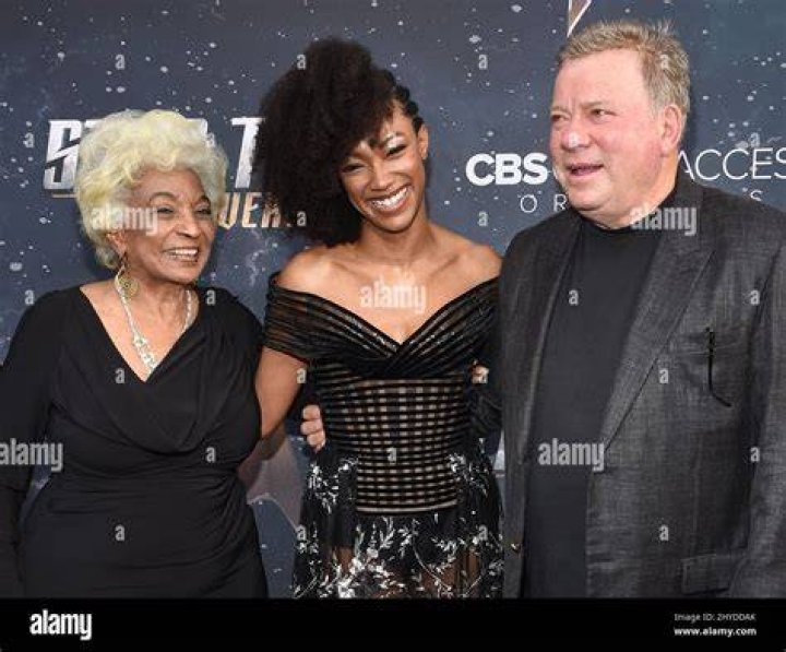 Nichelle Nichols and William Shatner get close during a scene