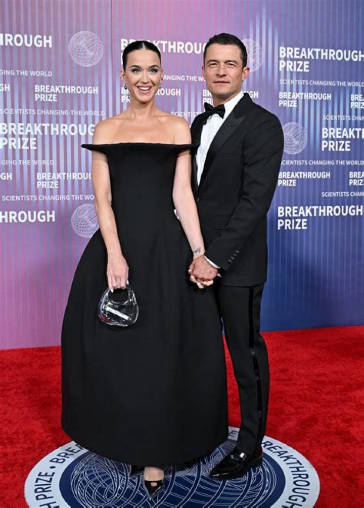 Orlando Bloom,Katy Perry. Orlando Bloom, right, a cast member in the Amazon Prime Video series "Carnival Row," shares a kiss with his girlfriend, singer Katy Perry, at the premiere of the series at the TCL Chinese Theatre, in Los Angeles LA Premiere of "Carnival Row", Los Angeles, USA - 21 Aug 2019