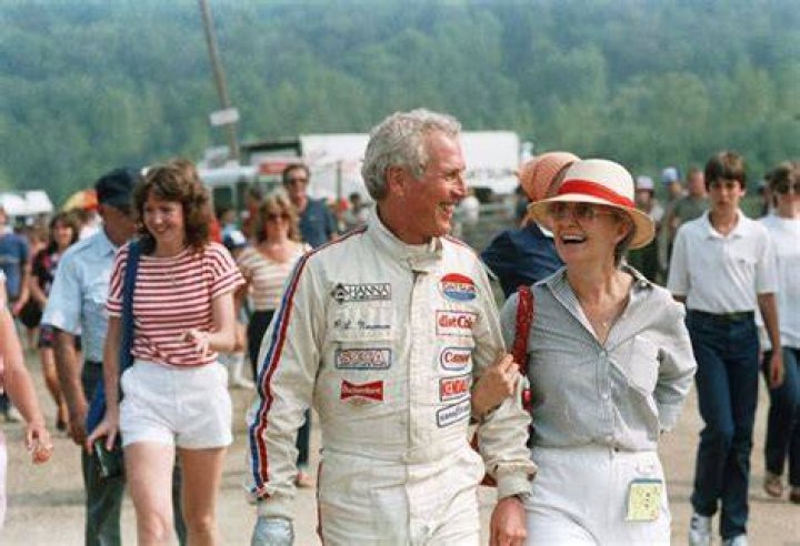 Paul Newman Smiles Besides Joanne Woodward After A Race