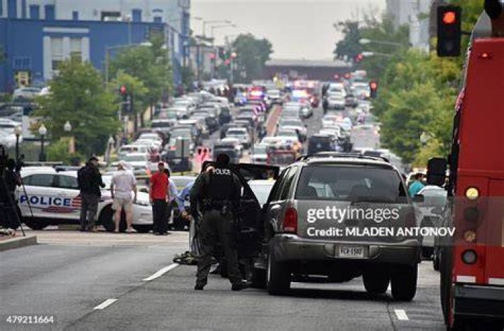 Police arrive at the scene to escort concertgoers to safety after hiding inside the Sands Corporation plane hangar after a gunman opened fire at the Route 91 Harvest Festival, in Las Vegas Shooting, Las Vegas, USA - 02 Oct 2017