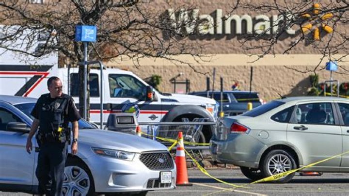 Police outside the Walmart shooting suspect&rsquo;s home.