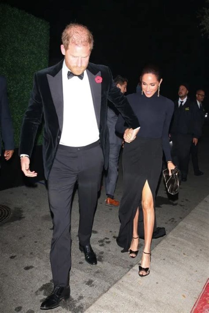Prince Harry holds Meghan Markle close