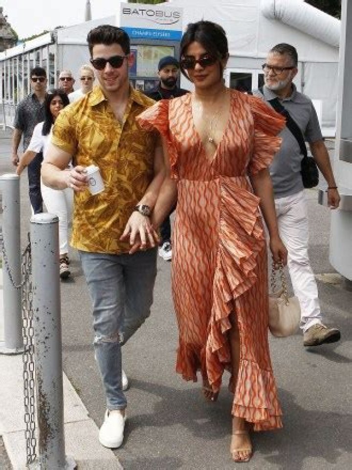 Priyanka Chopra Slays In Colorful Mini Dress & Boots While Holding Hands With Nick Jonas — Pics