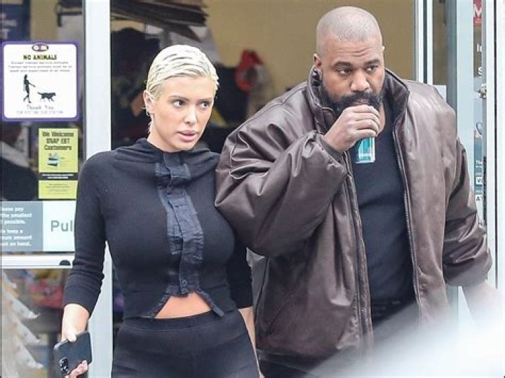 Rapper Kanye West and girlfriend Chaney Jones attend a game between the Miami Heat and the Minnesota Timberwolves at FTX Arena Celebrities at Miami Heat v Minnesota Timberwolves, Basketball at FTX Arena, Miami, Florida, USA - 12 Mar 2022