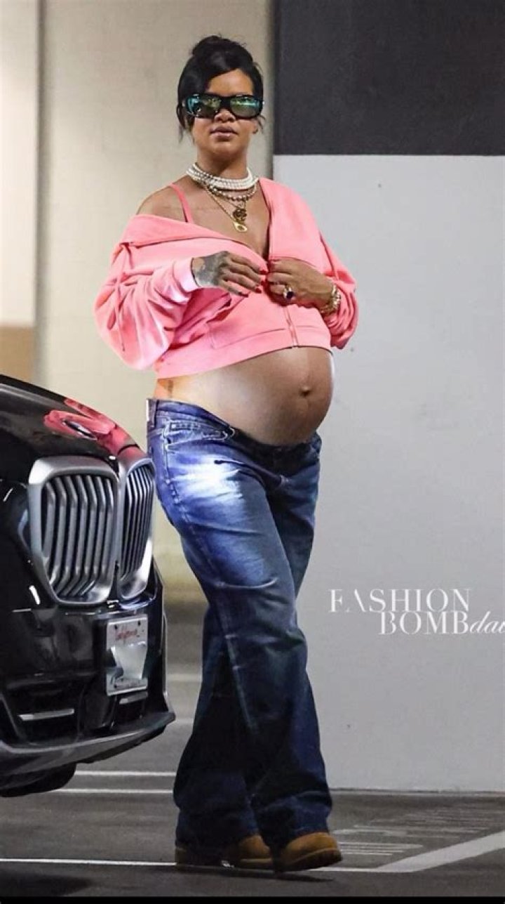 Rihanna wearing a hot pink dress