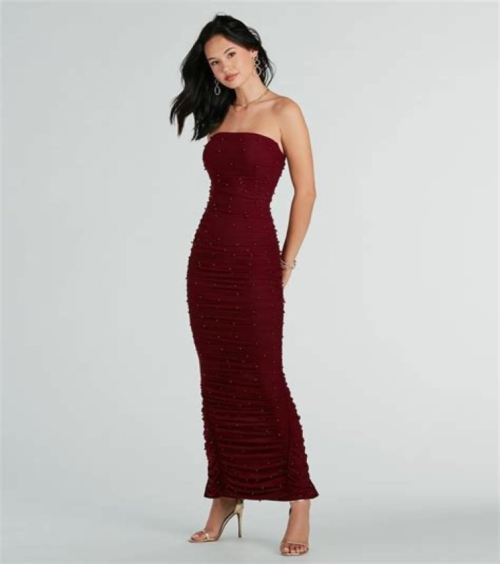 Rita Moreno, 89, Stuns In Burgundy Strapless Gown & Matching Coat At 2021 Oscars