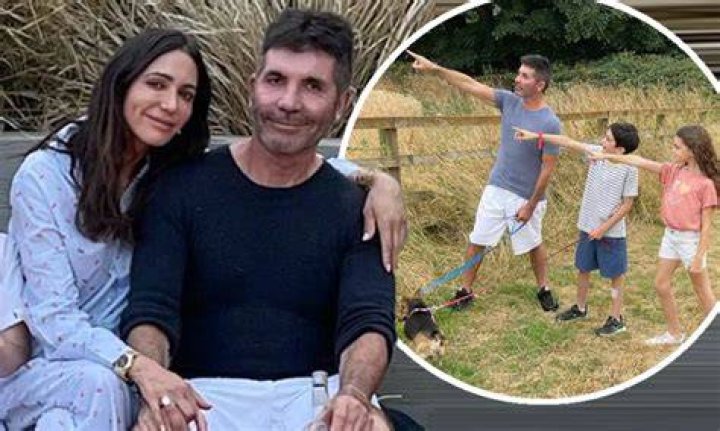 Simon Cowell & Lauren Silverman at an event