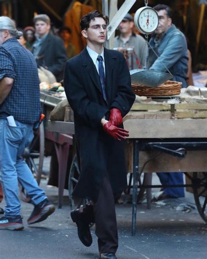 Timothee Chalamet on the set of "A Complete Unknown" in New York City smoking a cigarette